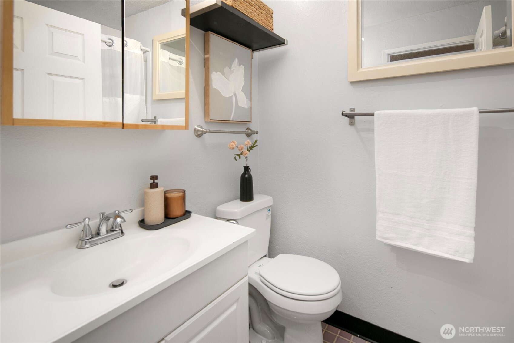 942 North 82nd Street Seattle, WA 98103 - Photo 10 of 16 a bathroom with sink and mirror