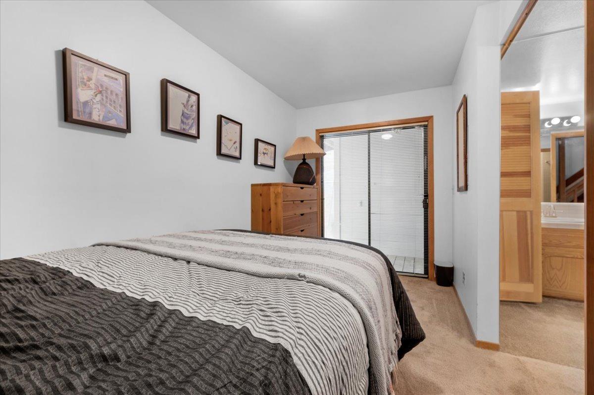 63221 Huntington Vista Road, Unit 83 Mono Hot Springs, CA 93642 - Photo 24 of 42 a bedroom with a bed and painting on the wall