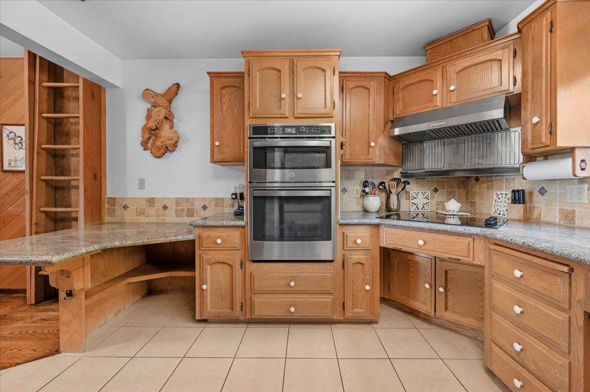 63221 Huntington Vista Road, Unit 83 Mono Hot Springs, CA 93642 - Photo 9 of 42 a kitchen with stainless steel appliances granite countertop a stove and cabinets