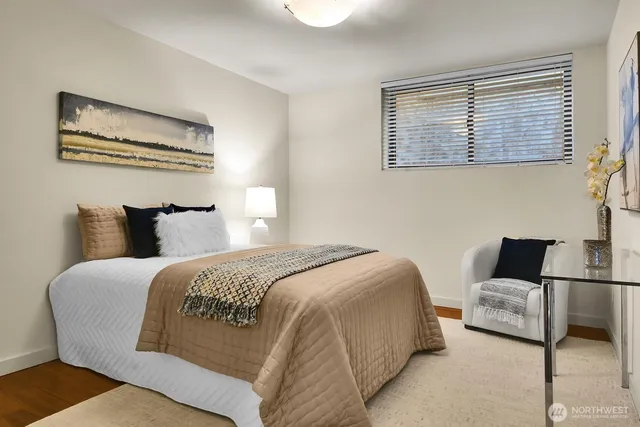 a bedroom with bed and window