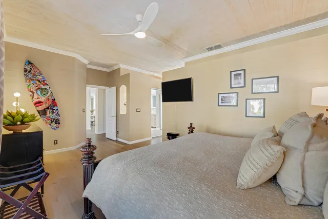 a bed room with a bed and a television