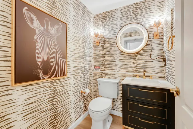 a bathroom with a toilet and a sink