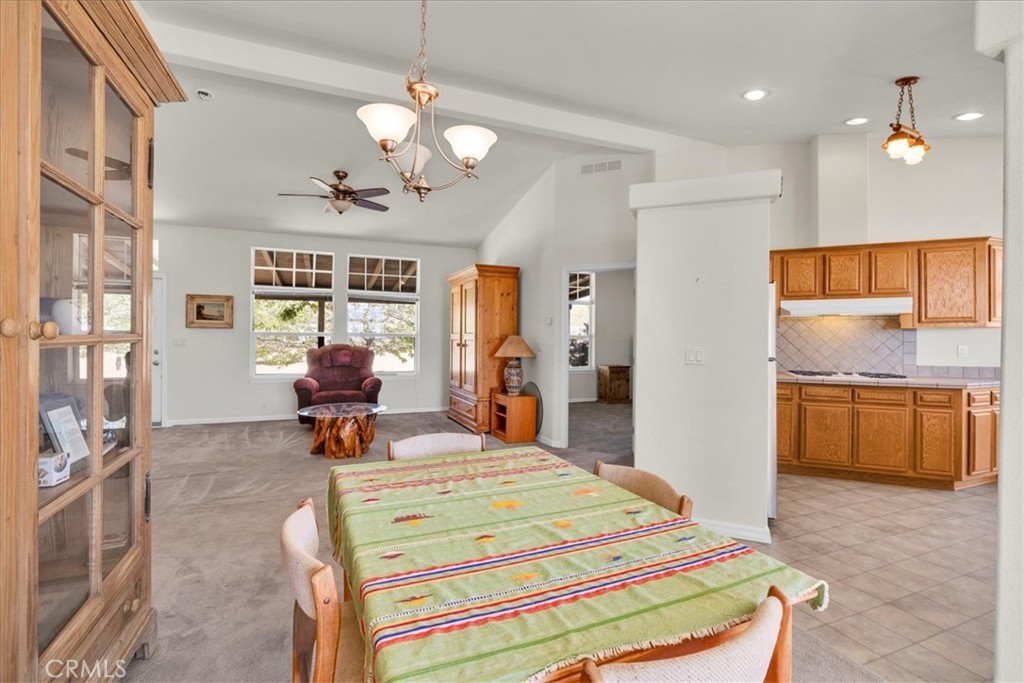 5175 Tom Mix Road Pioneertown, CA 92268 - Photo 13 of 58 a bed room with a bed and a chandelier