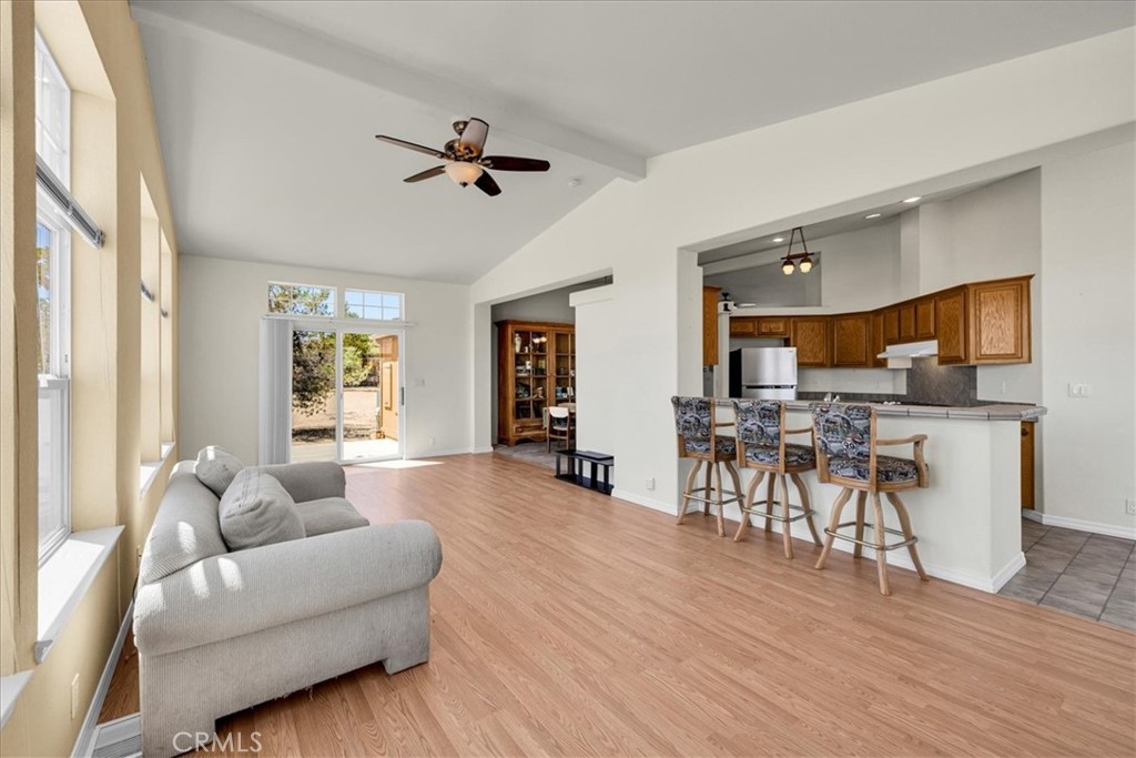 5175 Tom Mix Road Pioneertown, CA 92268 - Photo 16 of 58 a living room with furniture and wooden floor