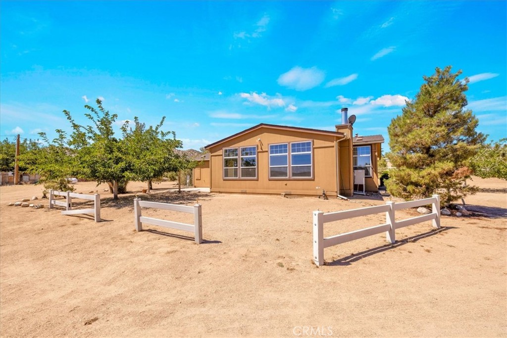 5175 Tom Mix Road Pioneertown, CA 92268 - Photo 37 of 58 a view of house with outdoor space and sitting area