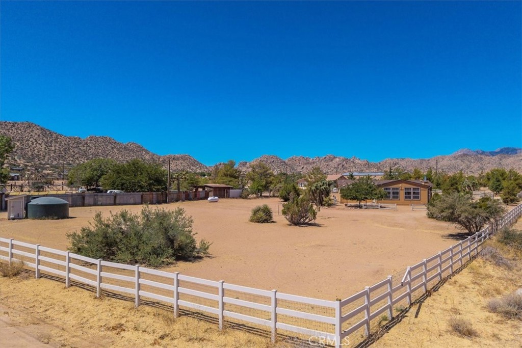5175 Tom Mix Road Pioneertown, CA 92268 - Photo 46 of 58 a view of a lake with a mountain in the background