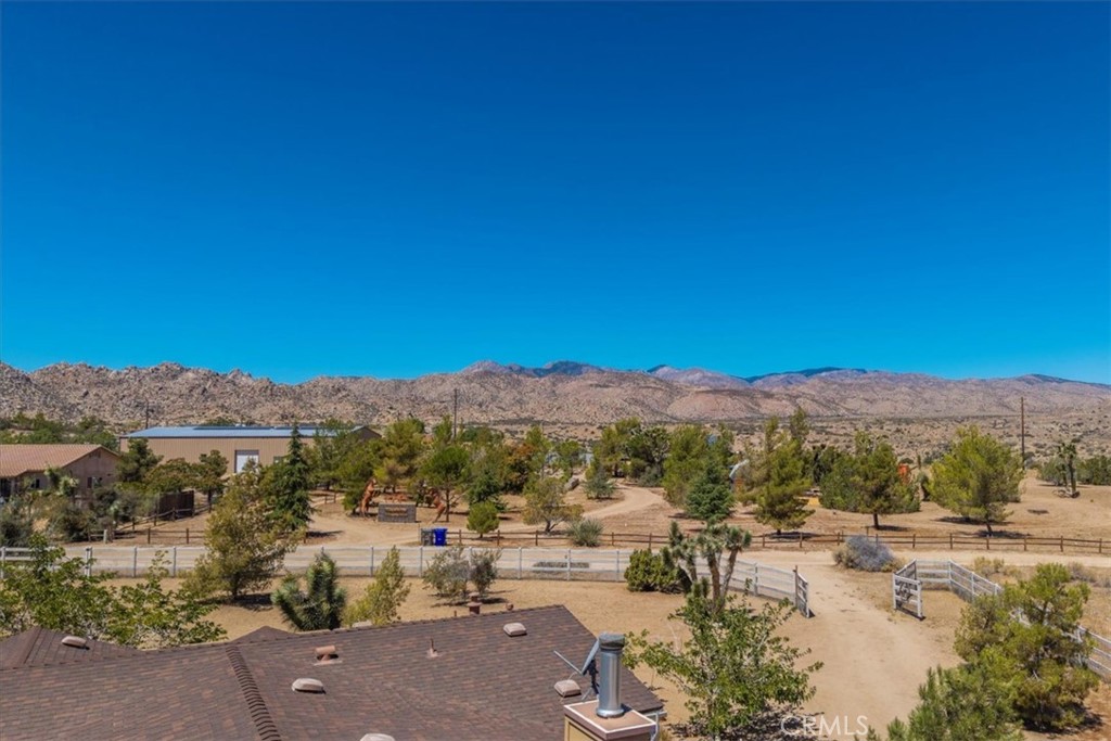5175 Tom Mix Road Pioneertown, CA 92268 - Photo 48 of 58 a view of a lake with mountains in the background
