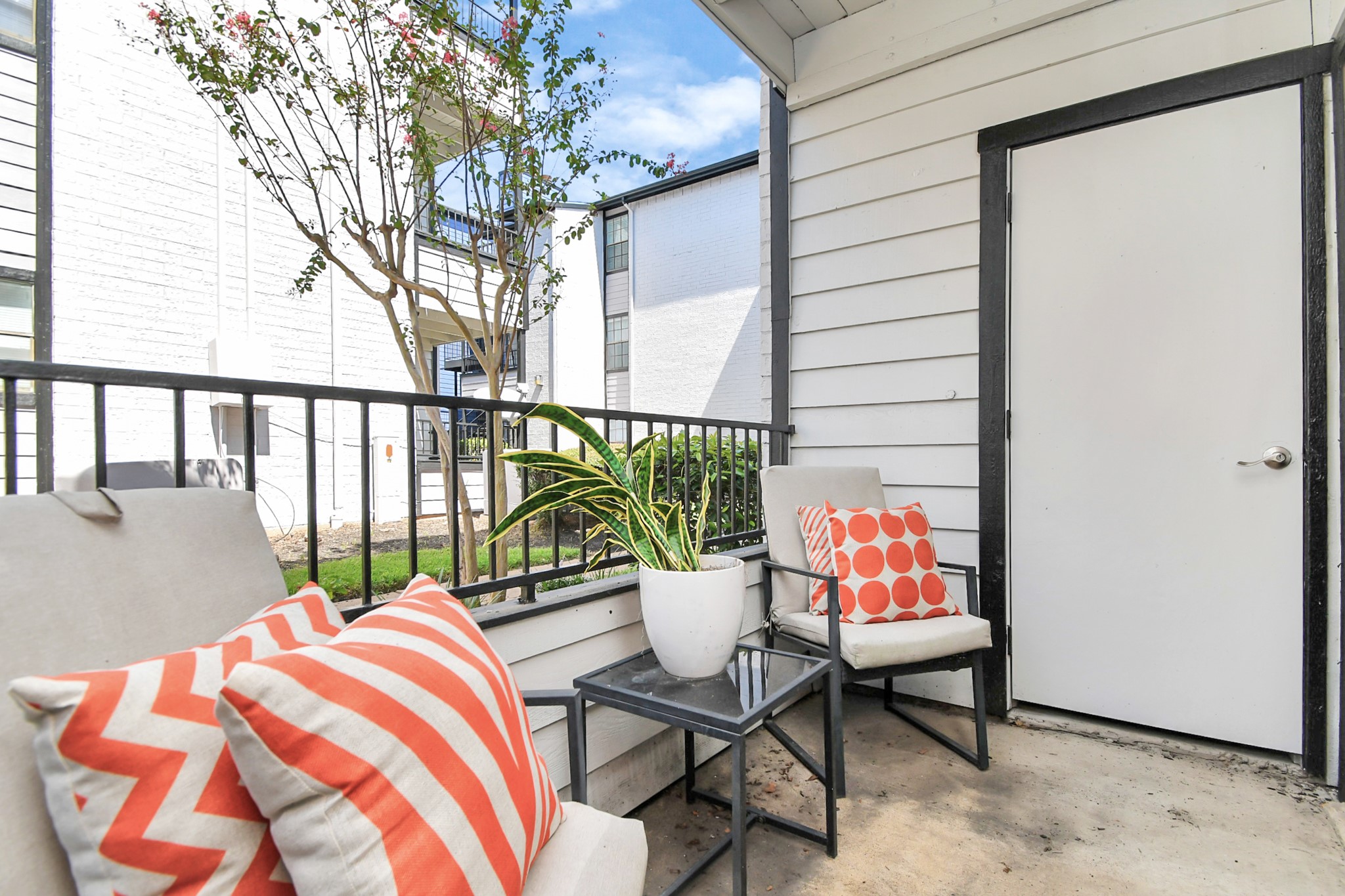 2701 West Bellfort Avenue, Unit 521 Houston, TX 77054 - Photo 23 of 44 a balcony with chairs and wooden fence