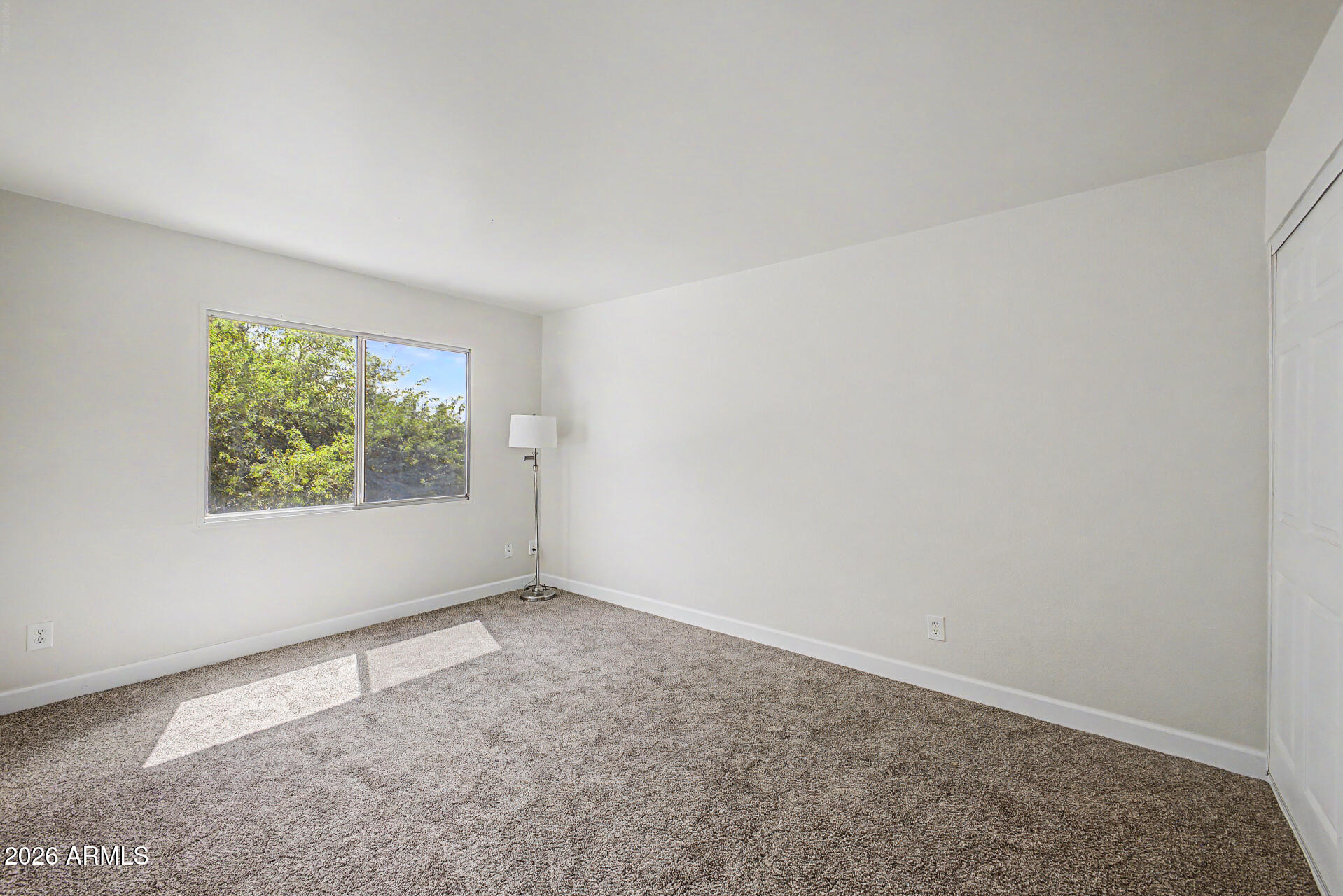 600 South Dobson Road, Unit 177 Mesa, AZ 85202 - Photo 13 of 24 an empty room with windows