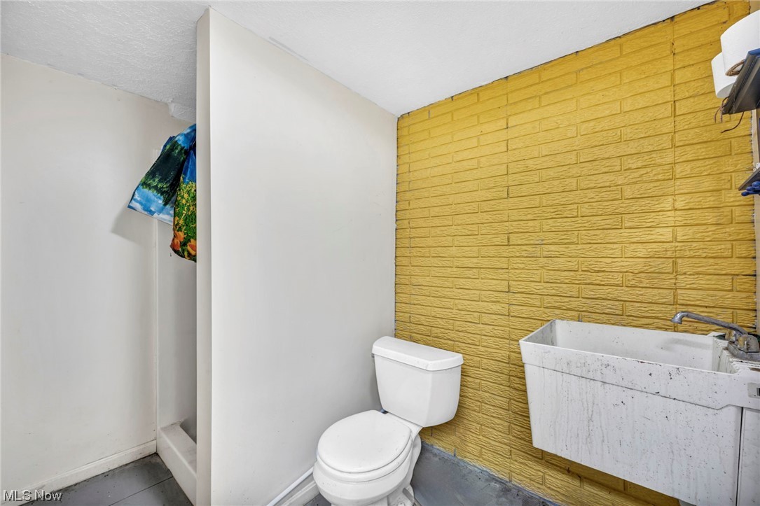 35808 Lorain Road North Ridgeville, OH 44039 - Photo 27 of 35 Basement Bathroom featuring toilet and sink
