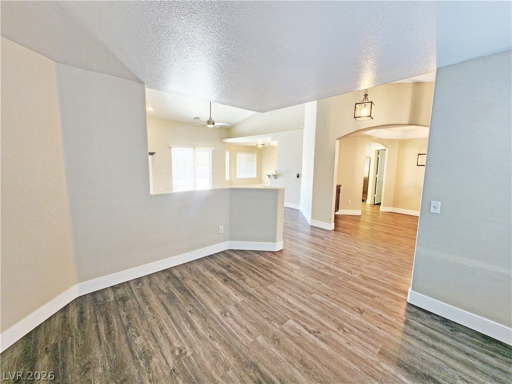 4591 Stoneham Street Pahrump, NV 89061 - Photo 8 of 42 Step into this luminous living space featuring wood-look flooring and an open layout.