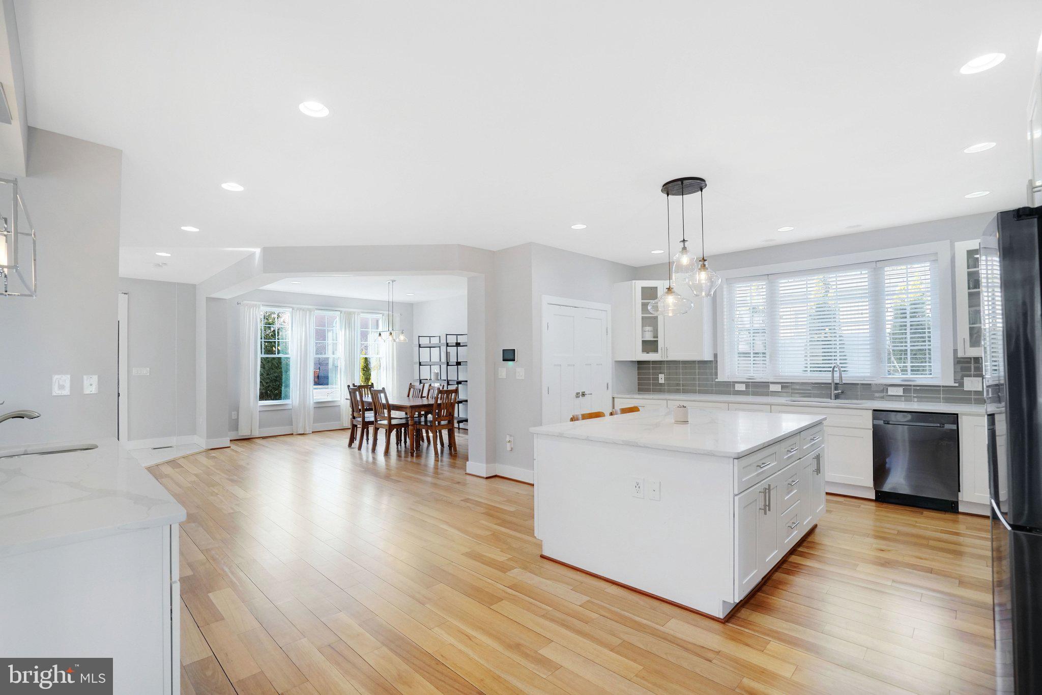 3731 Duke Street Alexandria, VA 22304 - Photo 14 of 57 a large kitchen with a table and chairs in it
