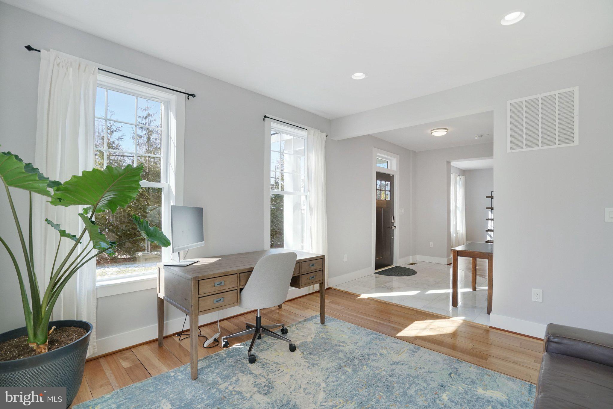 3731 Duke Street Alexandria, VA 22304 - Photo 19 of 57 a living room with furniture and a potted plant
