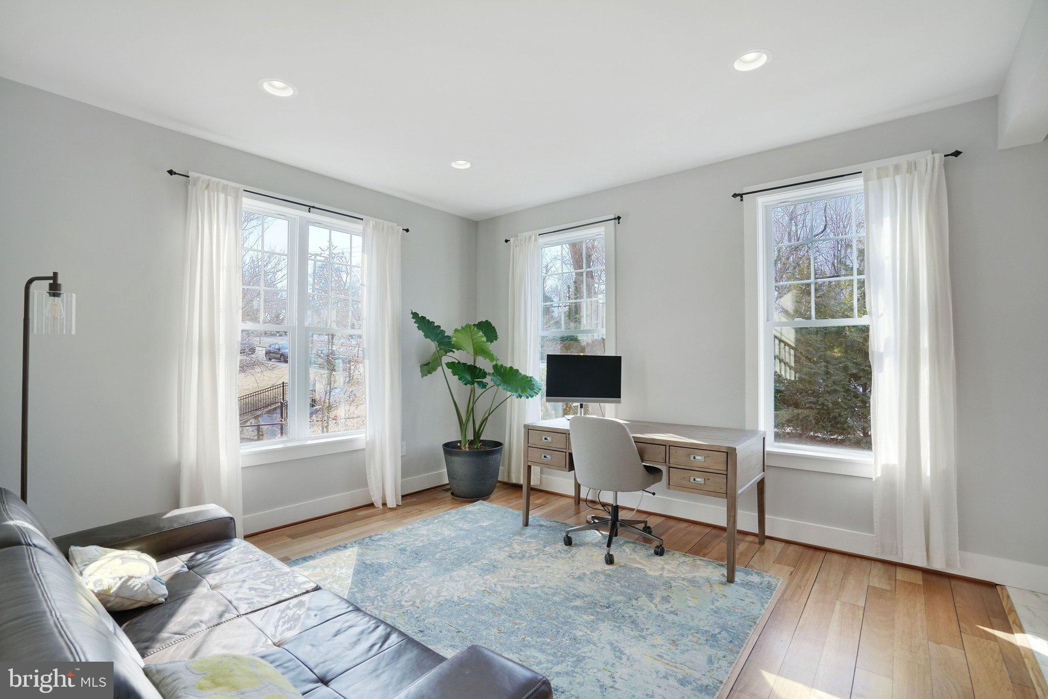 3731 Duke Street Alexandria, VA 22304 - Photo 20 of 57 a living room with furniture and a window
