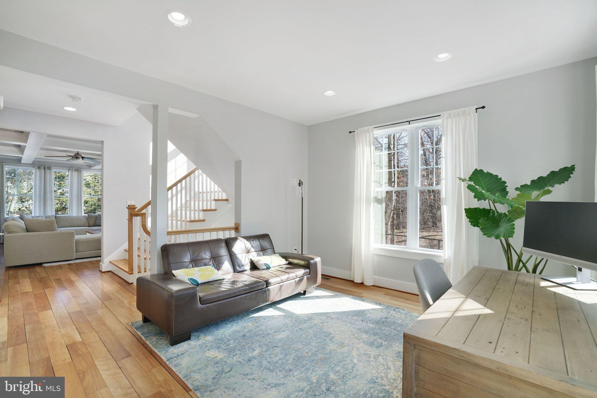 3731 Duke Street Alexandria, VA 22304 - Photo 21 of 57 a living room with furniture and a fireplace
