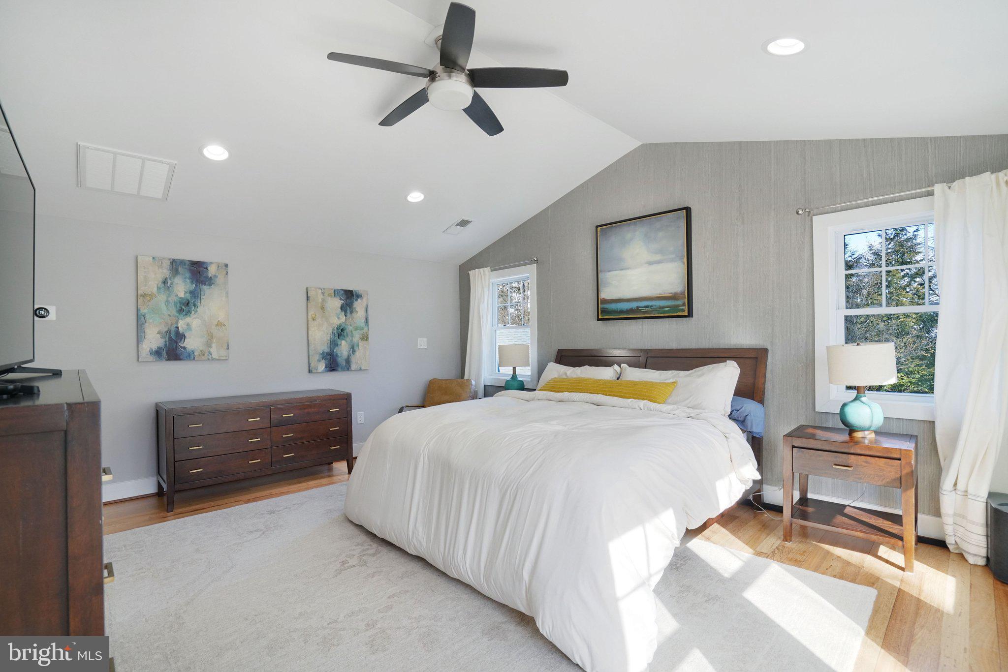 3731 Duke Street Alexandria, VA 22304 - Photo 23 of 57 a bedroom with a bed and a painting on the wall