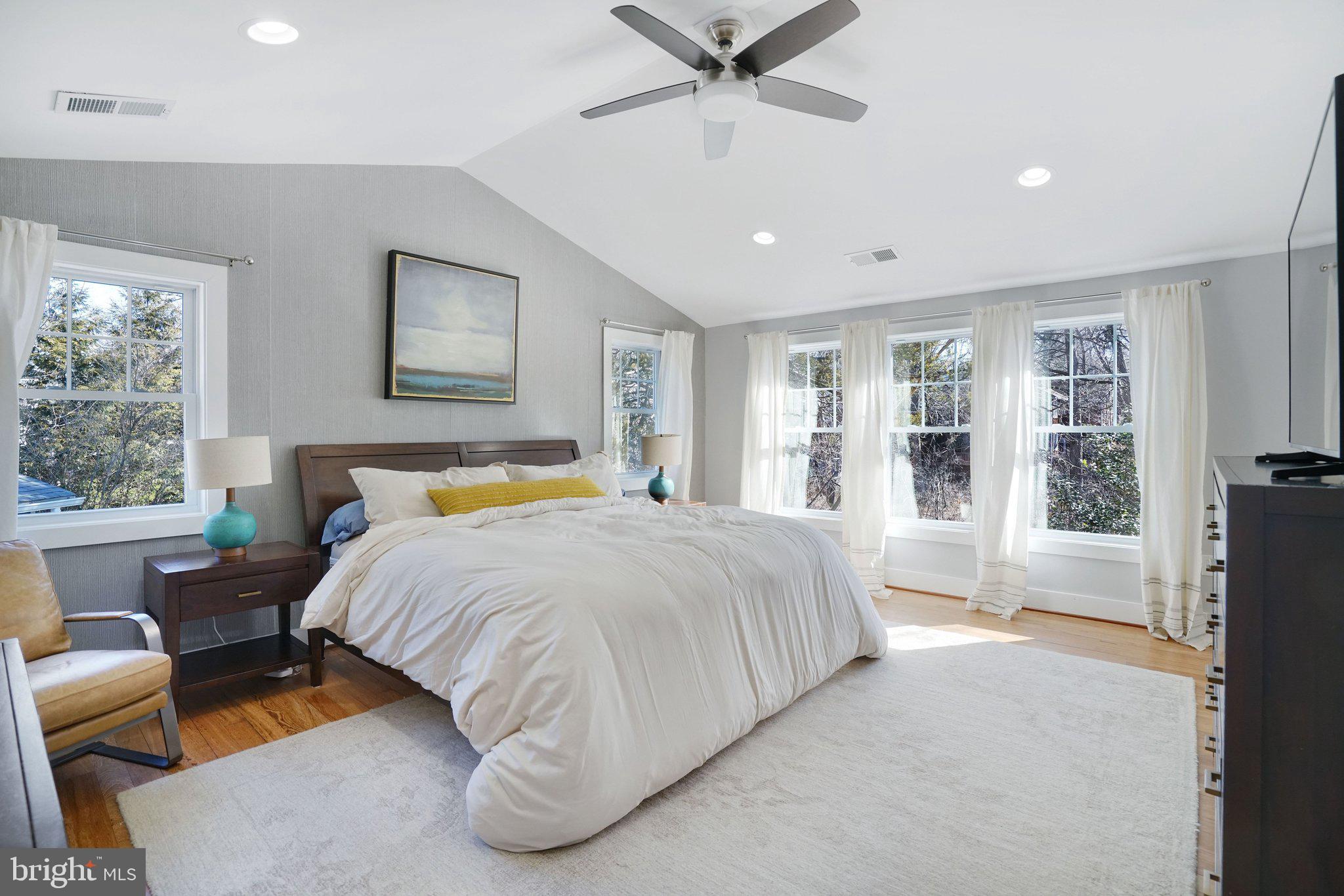 3731 Duke Street Alexandria, VA 22304 - Photo 24 of 57 a spacious bedroom with a large bed and a window