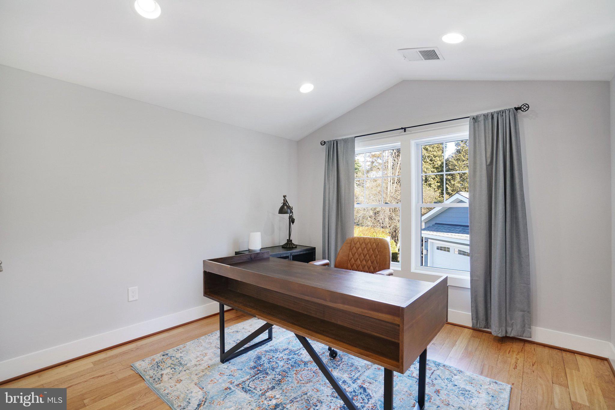3731 Duke Street Alexandria, VA 22304 - Photo 28 of 57 a workspace with furniture and wooden floor