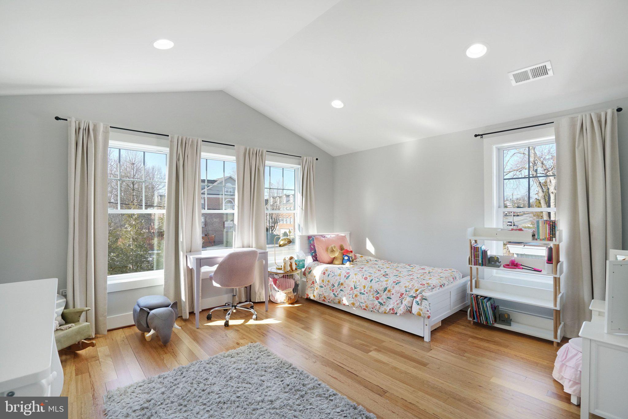 3731 Duke Street Alexandria, VA 22304 - Photo 31 of 57 a bedroom with two beds and a large window