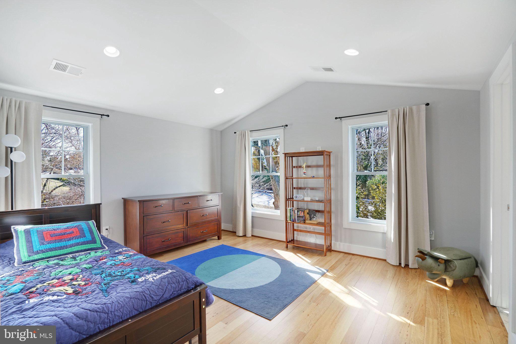 3731 Duke Street Alexandria, VA 22304 - Photo 35 of 57 a bedroom with a bed and wooden floor