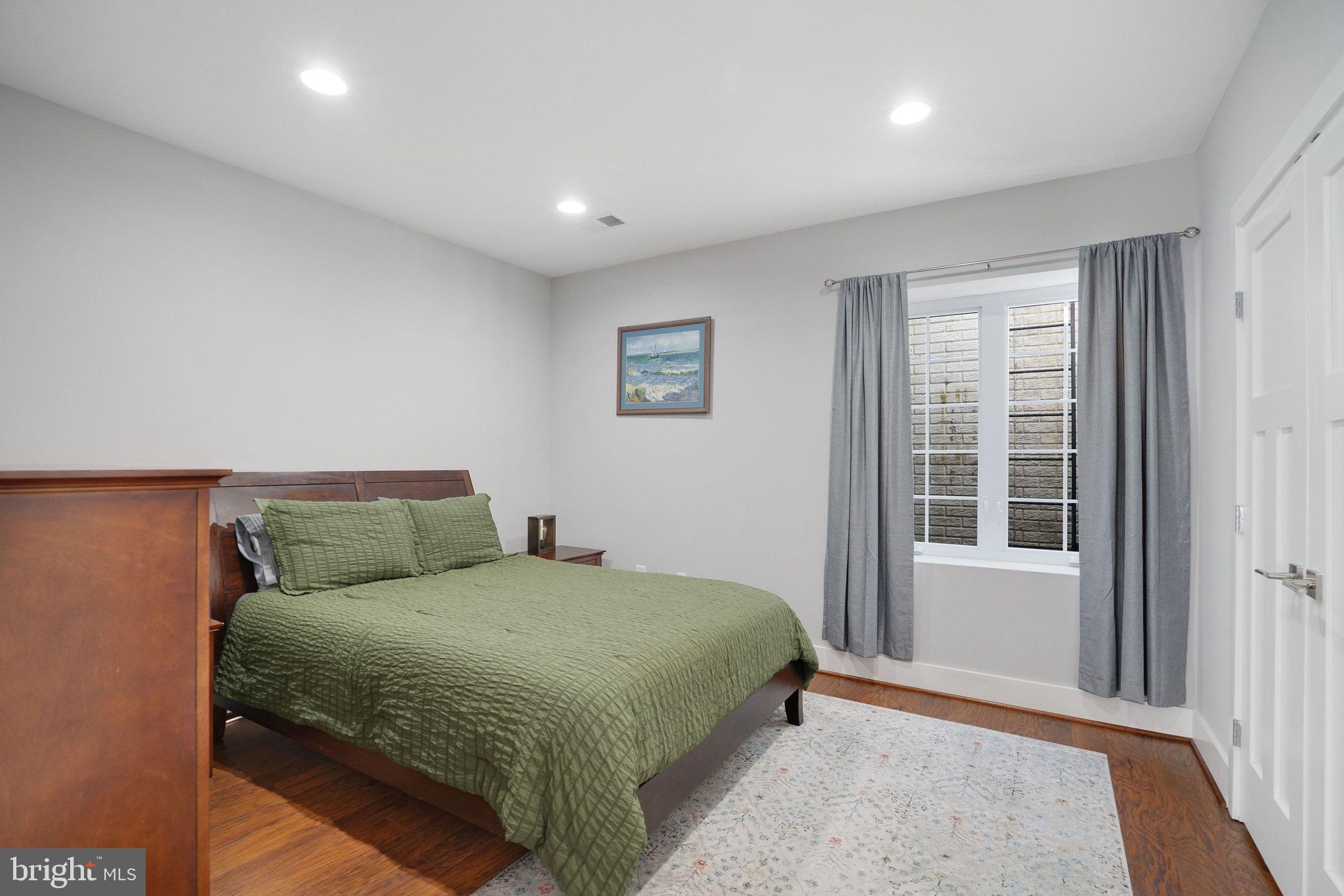 3731 Duke Street Alexandria, VA 22304 - Photo 47 of 57 a bedroom with a large bed and a window