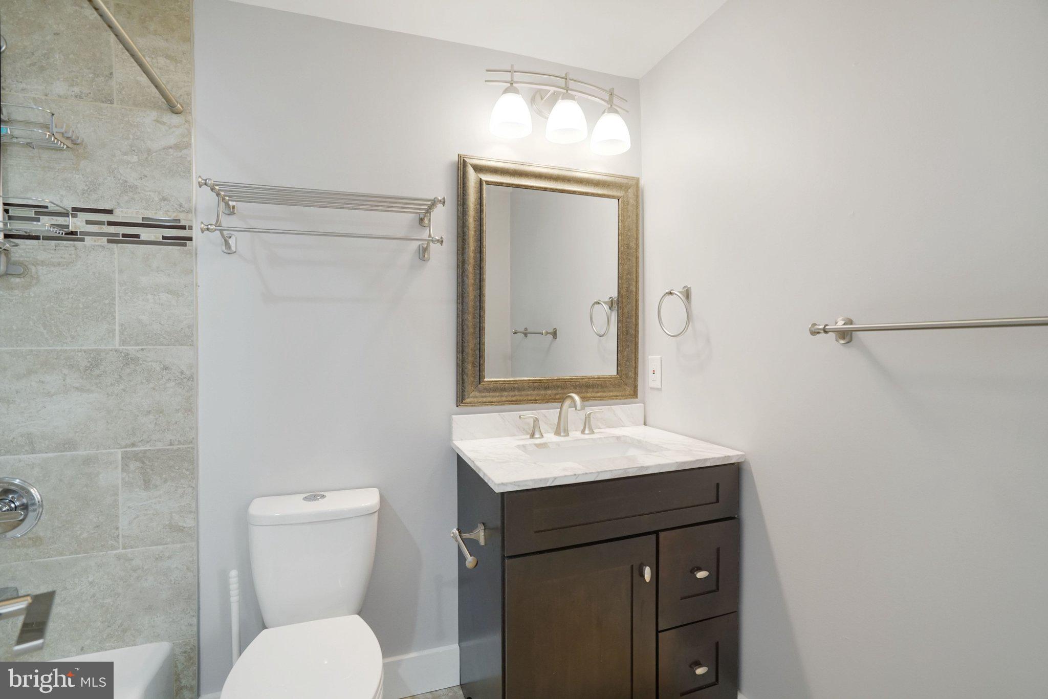 3731 Duke Street Alexandria, VA 22304 - Photo 48 of 57 a bathroom with a sink toilet vanity and shower