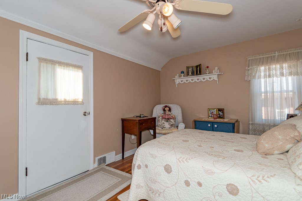 5444 Mayfield Road Cleveland, OH 44124 - Photo 21 of 34 Bedroom with vaulted ceiling, hardwood floors, and ceiling fan