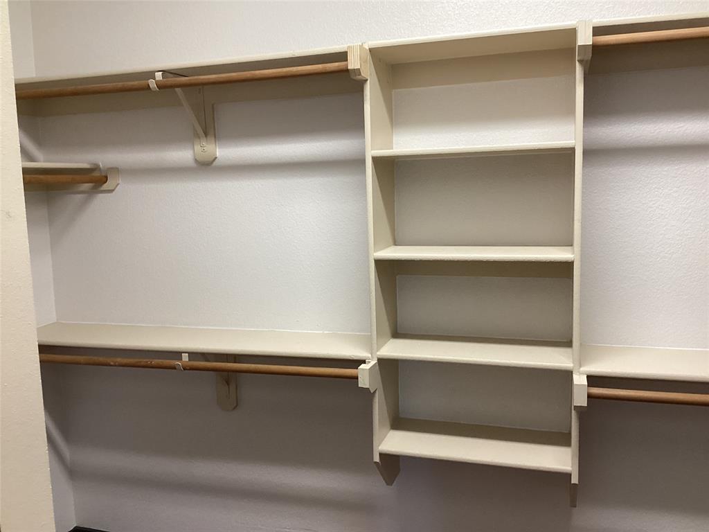 10320 Point Lobos Trail Fort Worth, TX 76177 - Photo 17 of 33 Custom closet system featuring built-in shelving, multiple hanging rods, and ample storage space