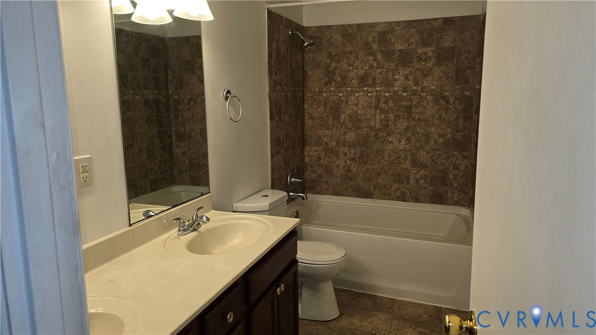 1501 Ivymount Road Richmond, VA 23225 - Photo 5 of 6 a bathroom with a sink toilet vanity and shower