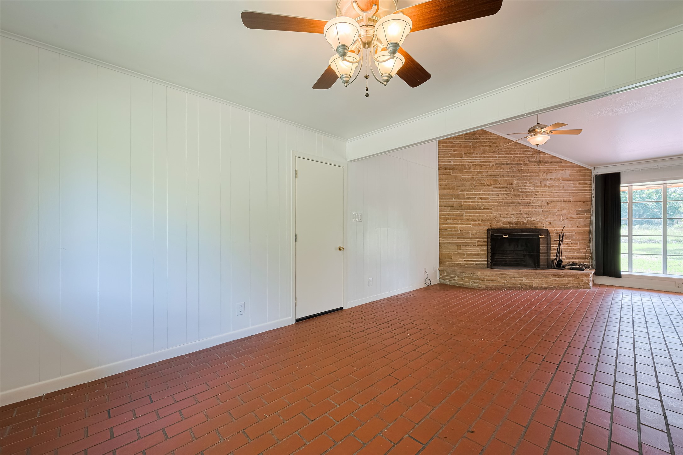 30525 Hegar Road Hockley, TX 77447 - Photo 11 of 49 a view of an empty room with chandelier fan and fire place