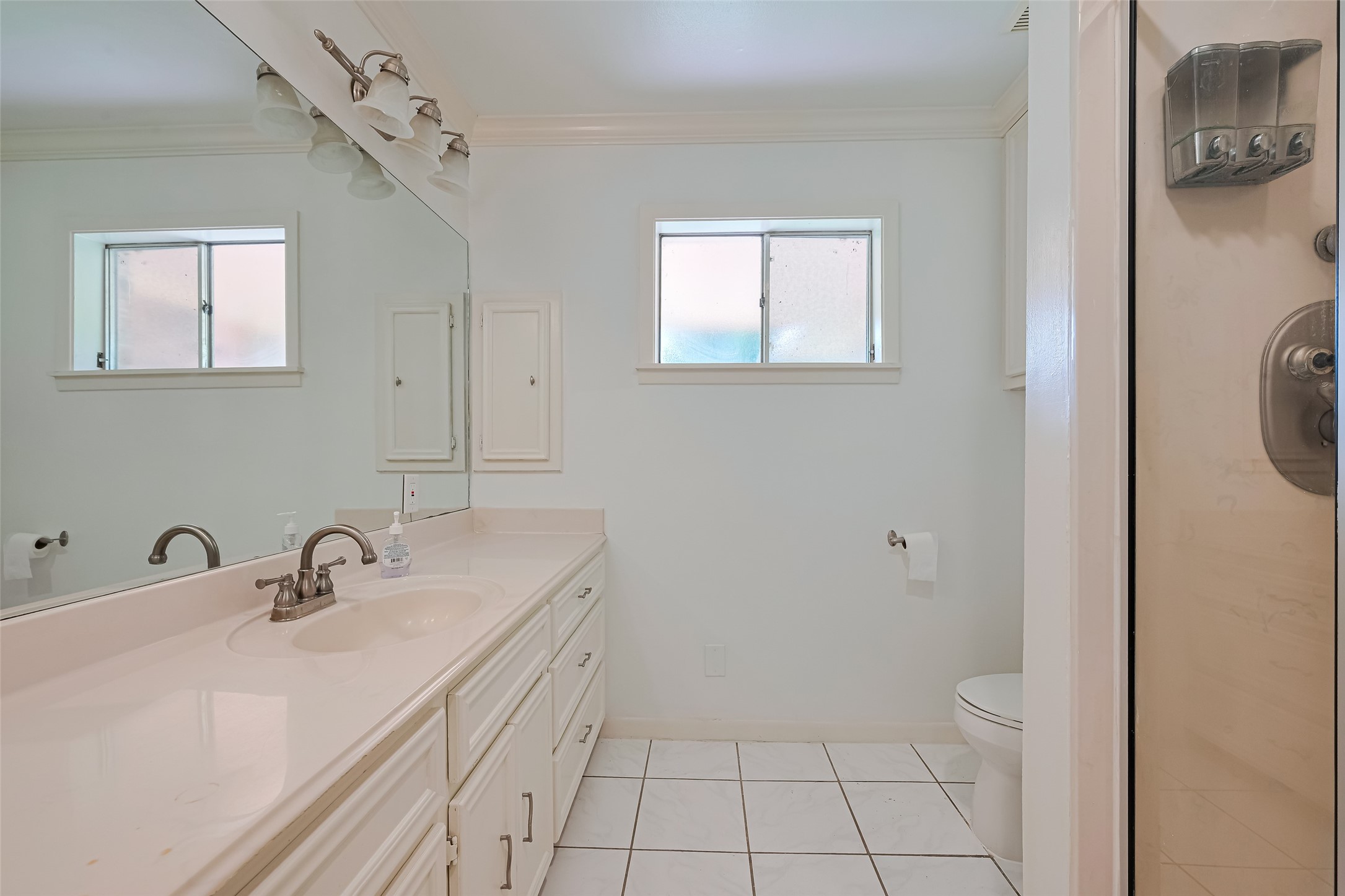 30525 Hegar Road Hockley, TX 77447 - Photo 20 of 49 a bathroom with a sink a toilet and mirror