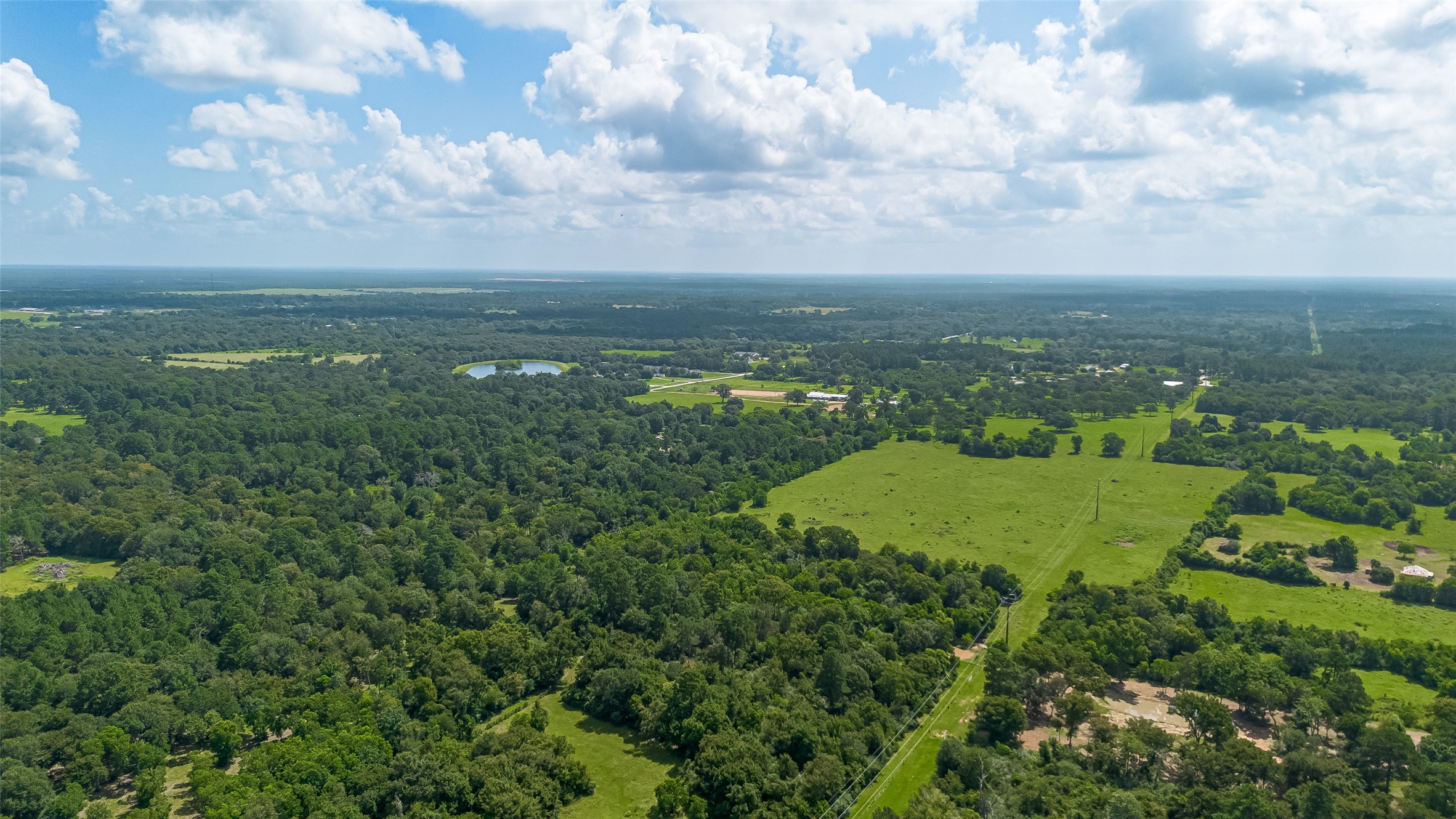 30525 Hegar Road Hockley, TX 77447 - Photo 45 of 49 a view of a lake with a big yard