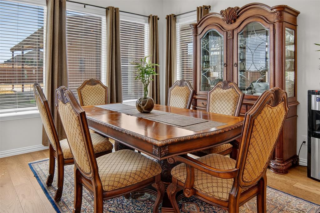 157 Misty Mountain Lane Rhome, TX 76078 - Photo 13 of 40 Dining area featuring light wood finished floors and baseboards