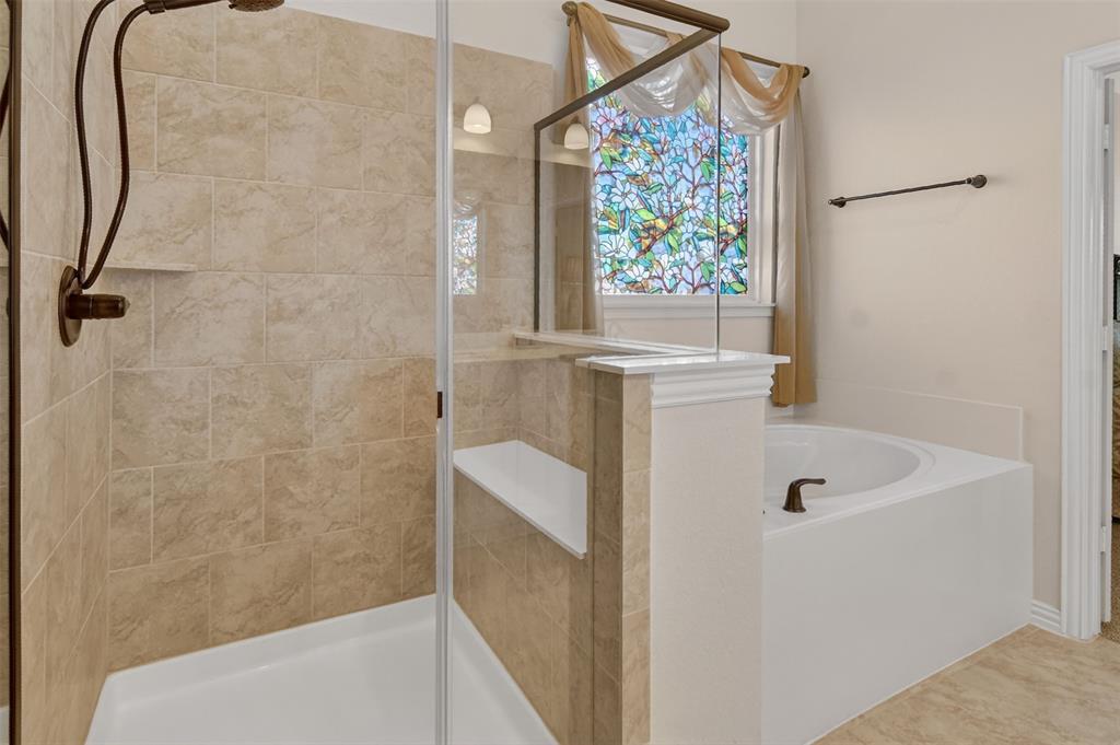 157 Misty Mountain Lane Rhome, TX 76078 - Photo 18 of 40 Primary bathroom with a bath and a tile shower