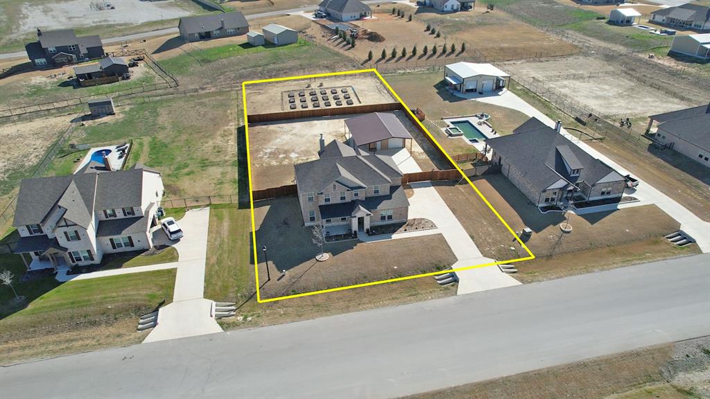 157 Misty Mountain Lane Rhome, TX 76078 - Photo 2 of 40 Aerial perspective of suburban area with property parcel outlined