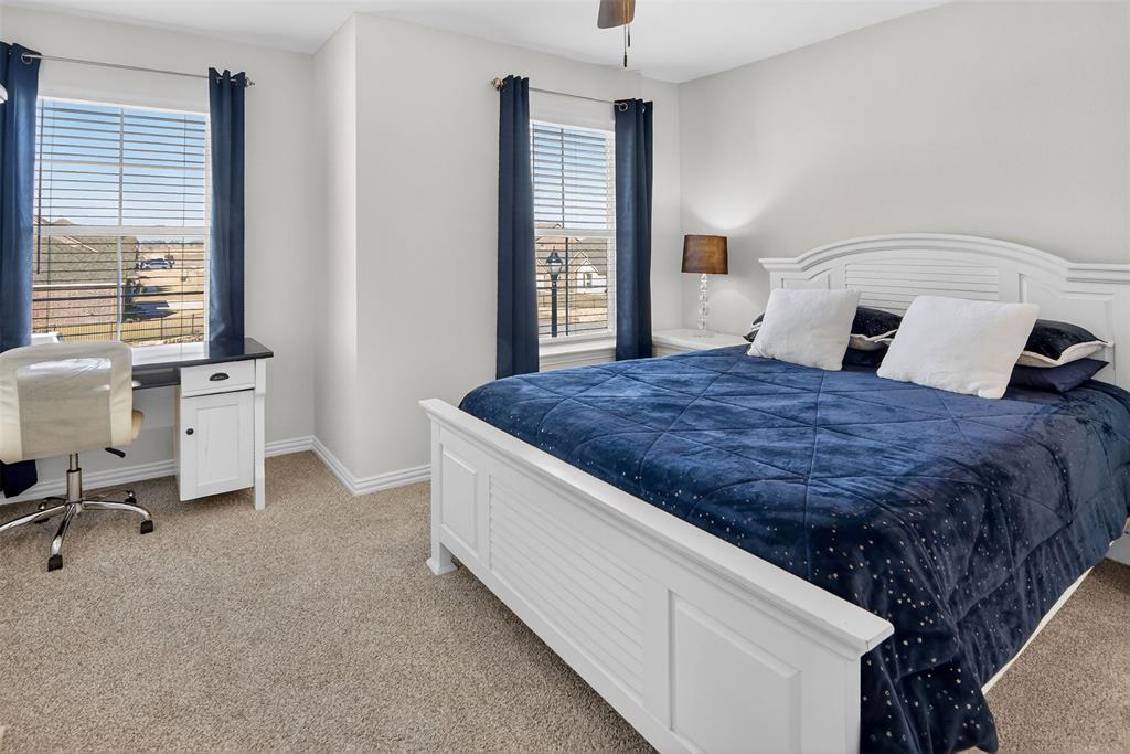 157 Misty Mountain Lane Rhome, TX 76078 - Photo 25 of 40 Bedroom with light colored carpet, ceiling fan, and a desk