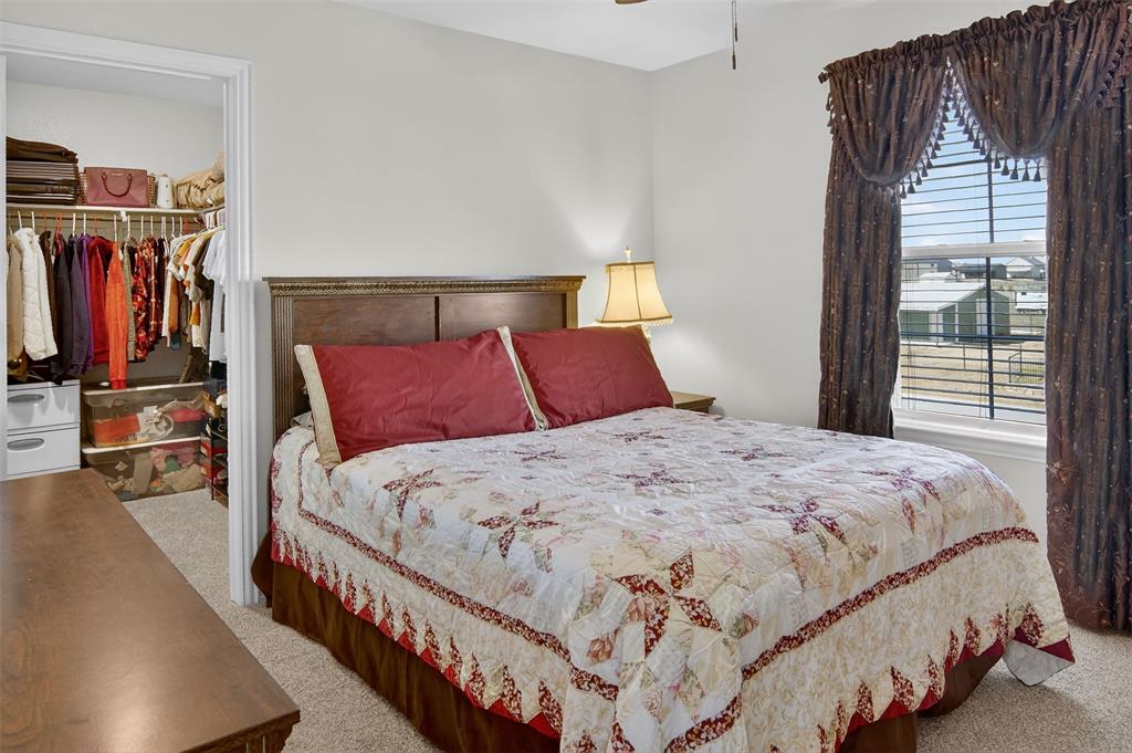 157 Misty Mountain Lane Rhome, TX 76078 - Photo 28 of 40 Bedroom with carpet flooring and a spacious closet