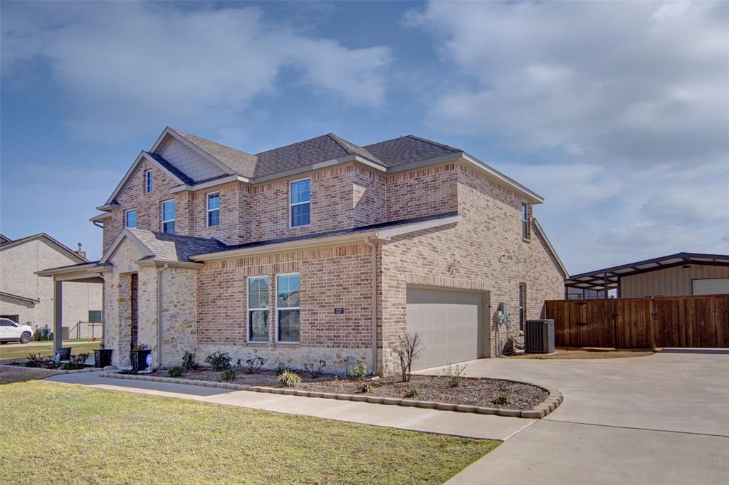 157 Misty Mountain Lane Rhome, TX 76078 - Photo 3 of 40 View of front of house featuring brick siding, concrete driveway, a shingled roof, and a gate