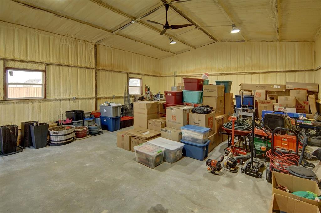 157 Misty Mountain Lane Rhome, TX 76078 - Photo 32 of 40 Insulation workshop with roll up door