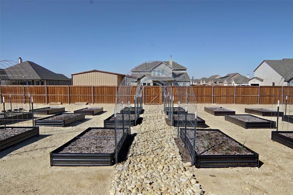 157 Misty Mountain Lane Rhome, TX 76078 - Photo 35 of 40 Fenced garden with raised beds for planting