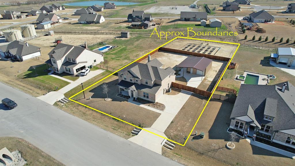 157 Misty Mountain Lane Rhome, TX 76078 - Photo 37 of 40 Amazing property, wonderful house, spectacular workshop, outstanding wood fence, and garden area