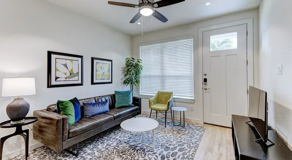 a living room with furniture and a window