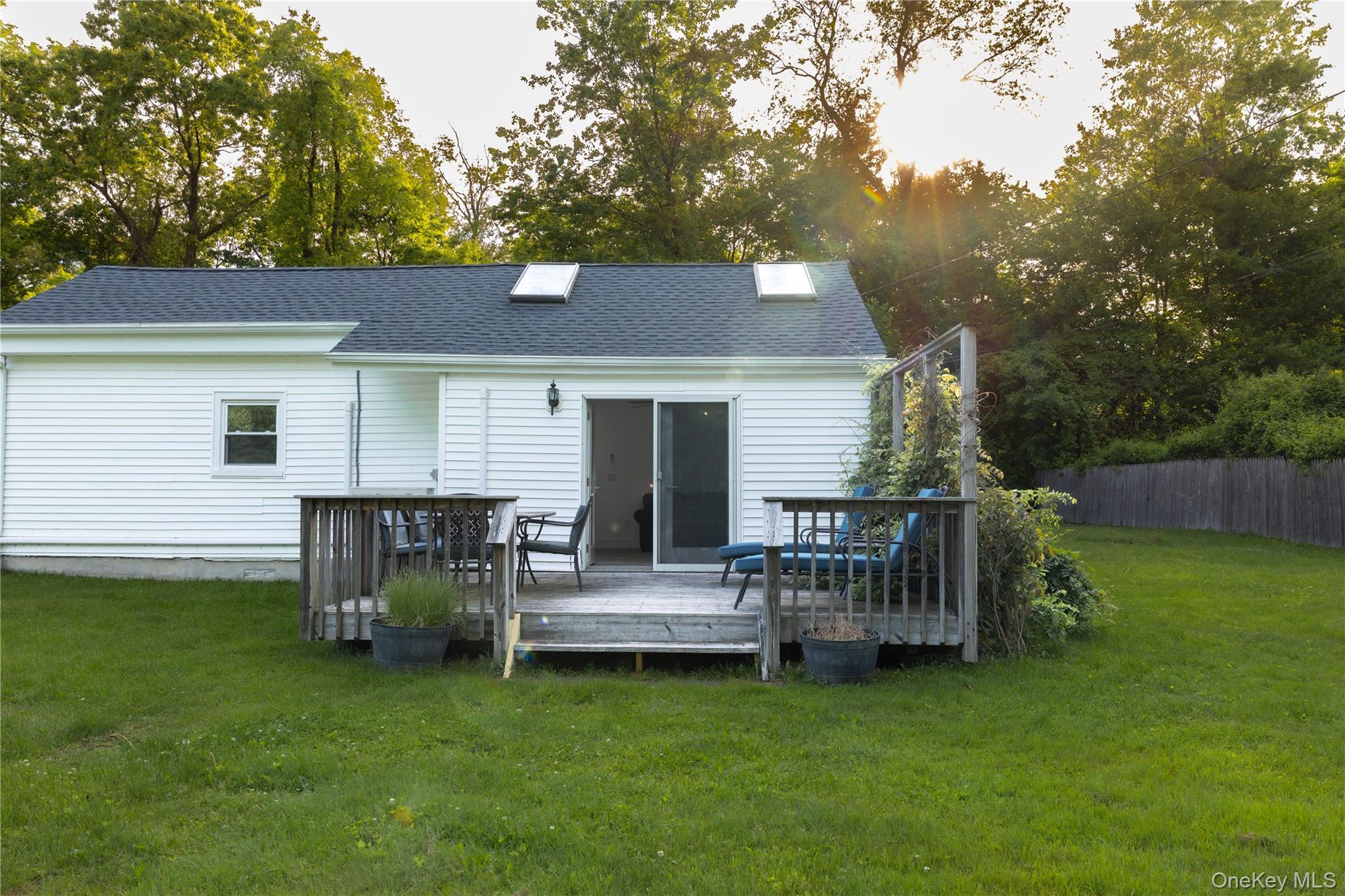 23 Lucille Road Carmel, NY 10512 - Photo 3 of 44 a view of a house with a chairs and table in the patio