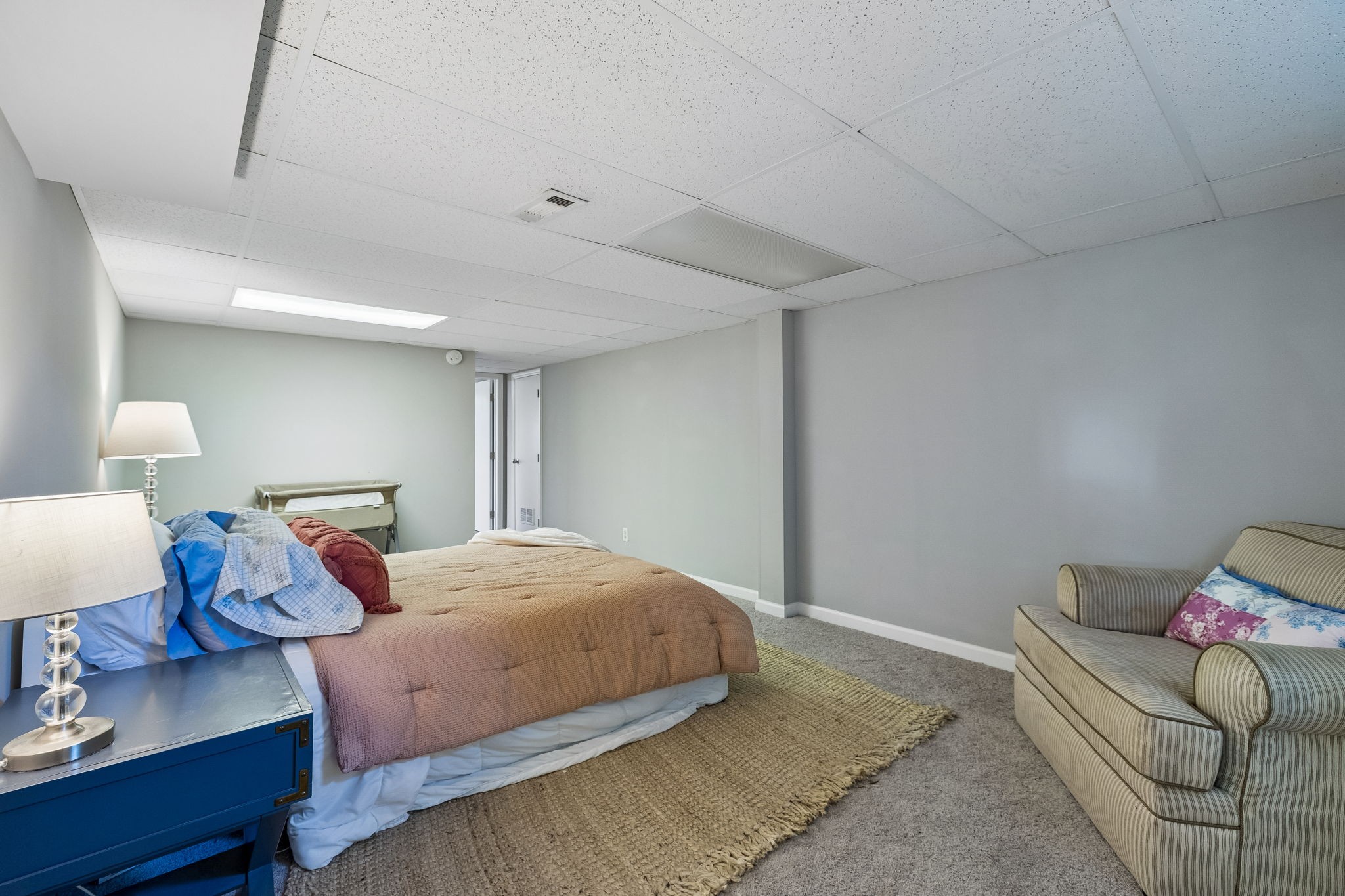 1326 Shahan Road Pleasant View, TN 37146 - Photo 30 of 41 a bedroom with a bed and wooden floor
