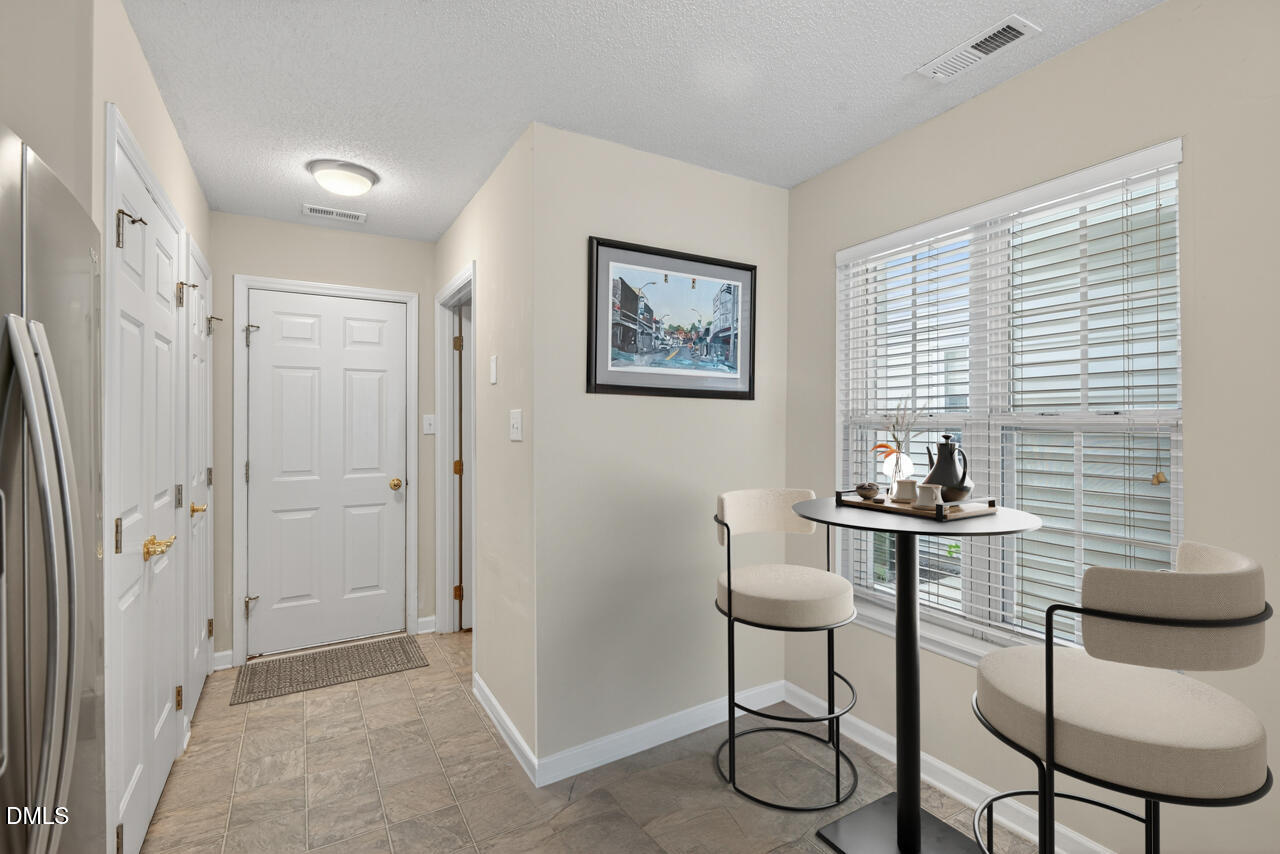 408 Intern Way Durham, NC 27713 - Photo 11 of 27 a dining room with furniture and window