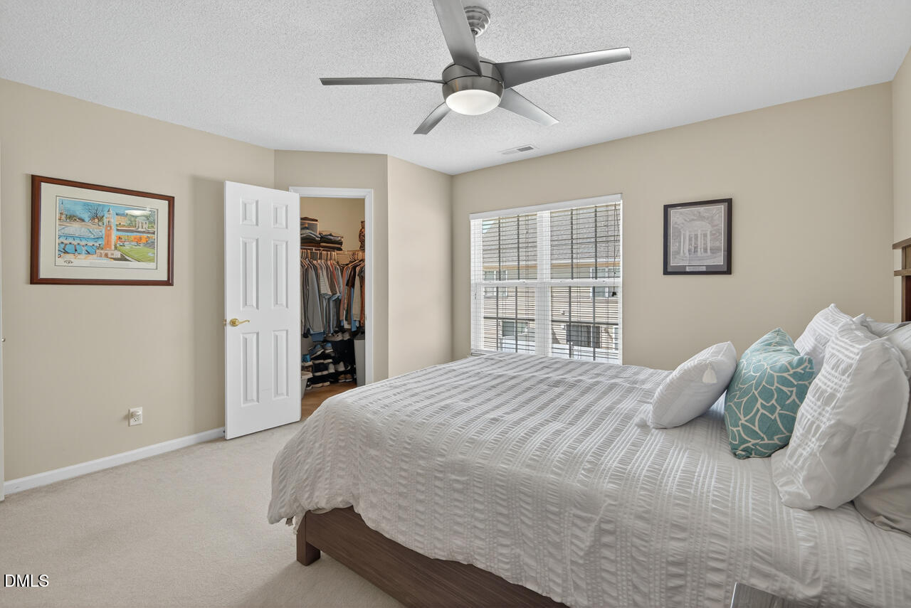 408 Intern Way Durham, NC 27713 - Photo 13 of 27 a bedroom with a large bed and a window