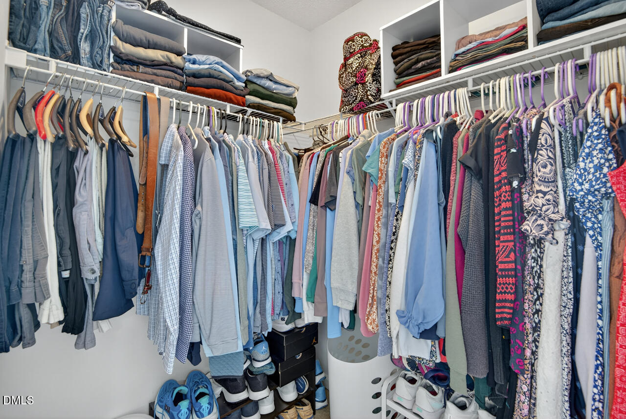 408 Intern Way Durham, NC 27713 - Photo 15 of 27 a view of walk in closet with clothes and shoes