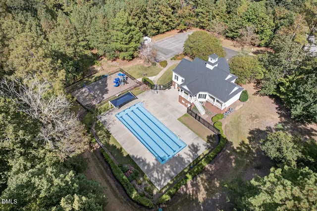 a view of swimming pool with seating area