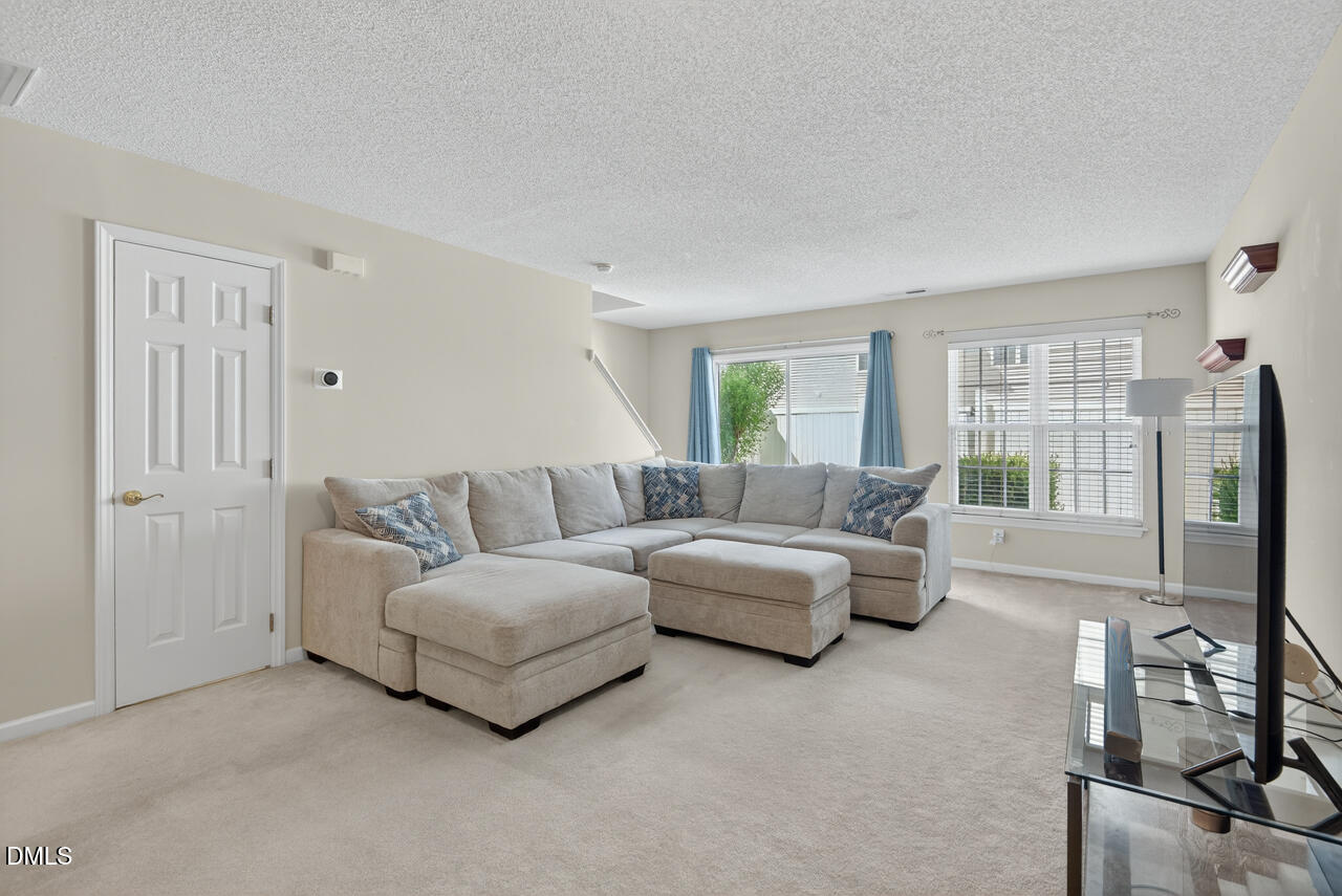 408 Intern Way Durham, NC 27713 - Photo 2 of 27 a living room with furniture and a large window