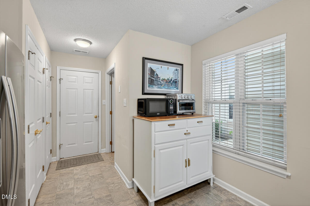408 Intern Way Durham, NC 27713 - Photo 9 of 27 a room with a washer and a window